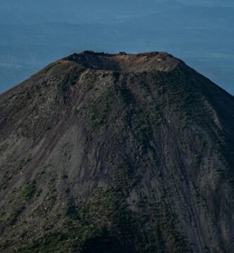 Stunning aerial photo of Izalco Volcano in El Salvador, showcasing its crater and rugged slopes.
